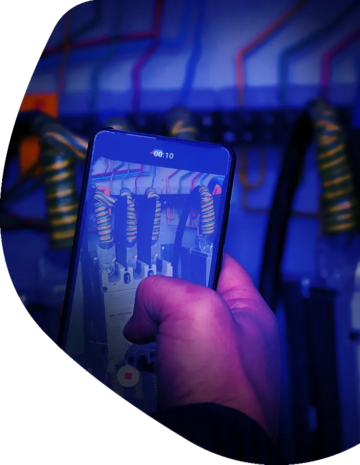 Technician capturing photo evidence of electrical equipment with the Trucheck mobile inspection app